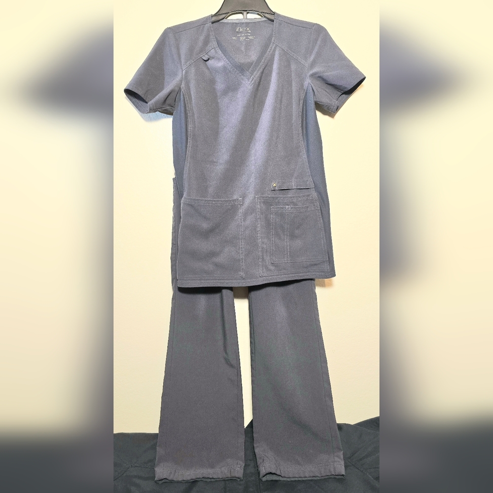 This is a XXSCherokee iFlex women's V-neck scrub top in gray with four pockets. 